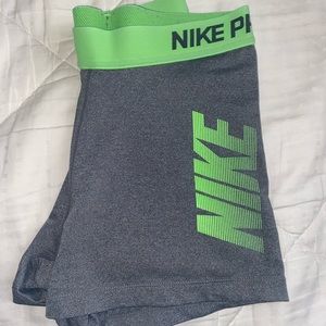 Gray Nike Pro Spandex with Neon Green Waistband. Size Medium